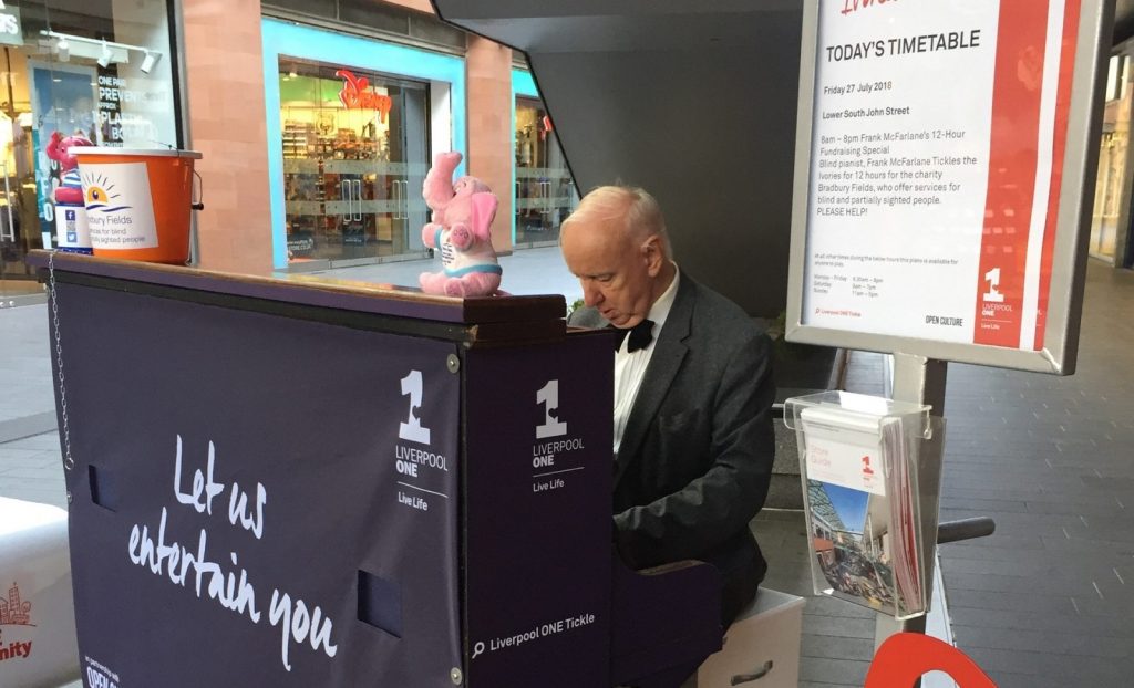 Frank playing the piano in Liverpool One